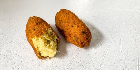 Golden-brown codfish fritters whisper of coastal feasts, savory nostalgia bites, Carnival...