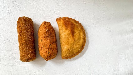 Crisp empanadas and kibbeh beckon with golden crunch, evoking street food festivals and the...