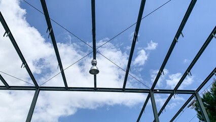 Skeletal metal framework cradles sky symphony, industrial zen canopy whispers, Sechselauten...