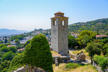 Fototapeta premium Clock tower of Stari grad Bar (Old Town of Bar), the ruins of an ancient walled city at the foot of Mount Rumija in Montenegro