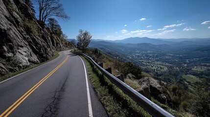Naklejka premium Winding mountain road with valley view