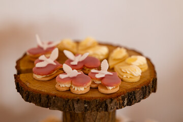 Delicious heart shaped cookies with doves decorating a rustic wooden centerpiece