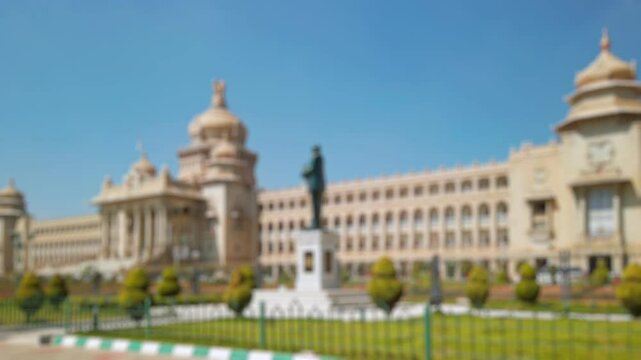 Bokeh view of Government office building (Suvarna Vidhana Soudha) in Bangalore, India. Blurred background footage.