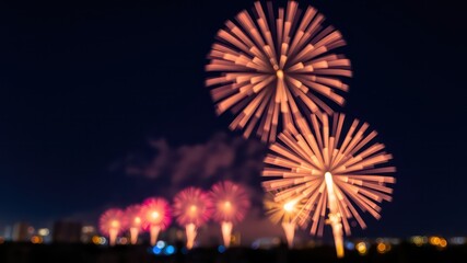 Nighttime Celebration A Festive Display of Fireworks with a Blurred Cityscape in the Background