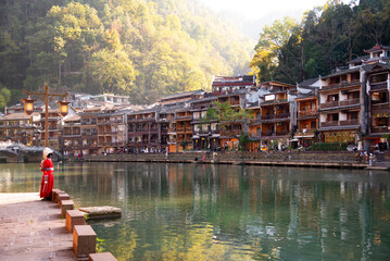Fenghuang ancient town, China. Traditional chinese wooden houses in old watertown