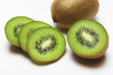 Fototapeta premium Fresh Kiwi fruit , sliced , halved on white background