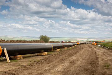 Gas and oil pipeline construction. Pipes welded together. Big pipeline is under construction....