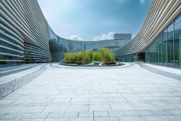 Empty stone paved square in front of modern curved office buildings. Business architecture and...