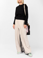 Fashion shooting in studio . Professional model , fashionable clothes and style, new collection. stylish look.