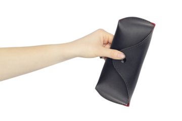 glasses case in hand, outstretched hand with leather glasses case, isolated from background
