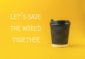 Black coffee cup with a white lid on a yellow background