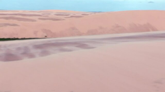 Smooth slopes of sand dunes forming a vast, unbroken desert expanse, highlighted by soft ridges and delicate textures in the arid landscape
