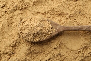 Superfood. Turmeric powder and spoon, top view
