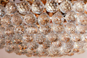 Elegant crystal chandelier capturing light and reflections in a luxurious interior space