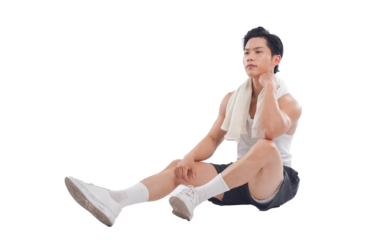 Portrait of muscular Asian man in sportswear sitting posing on white background