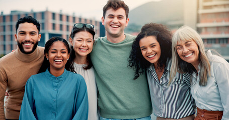 Hug, portrait and smile of business people in city together for collaboration, unity or solidarity. Creative, friends and rooftop with employee group embracing outdoor in urban town for design career