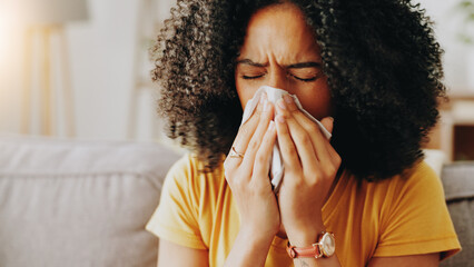 Sofa, woman and sick with tissue for blowing nose, allergy and inflammation of sinus in living...