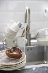 Dirty soapy dishes on the kitchen sink