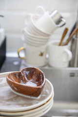 Dirty soapy dishes on the kitchen sink