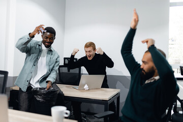 Office Team Celebrating Success with Enthusiastic Teambuilding Exercises in Modern Workspace