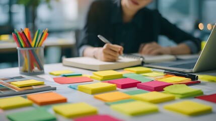 reclining on a couch with laptop on knees and headphones on, focused expression