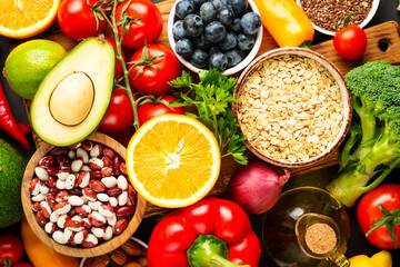 Healthy food assortment on black background.