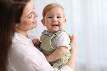 Mother with her cute little baby at home