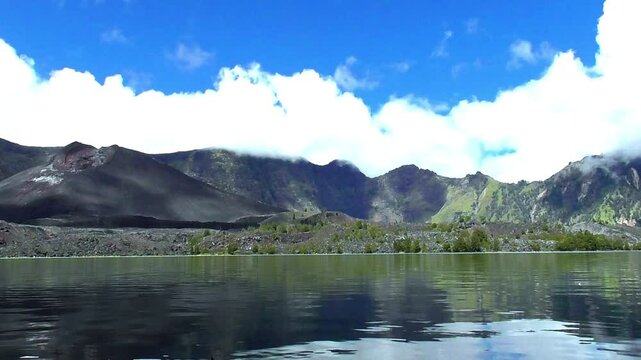 Baru Jari over Segara Anak lake on mount Rinjani