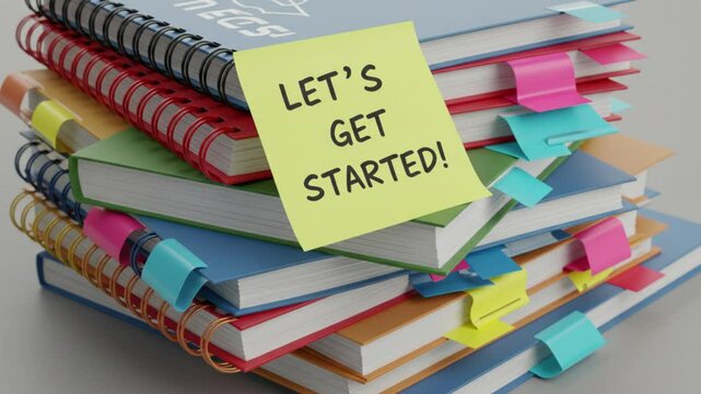 Ready to Begin: A vibrant stack of notebooks and books, adorned with colorful sticky notes, beckons with an inviting message, perfect for sparking inspiration.