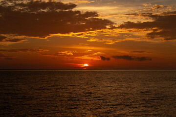 beautiful cloudy sunset sky with sun lighting.