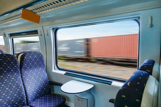 Empty interior of the train for long and short distance in Europe train carriage with blue seats.             