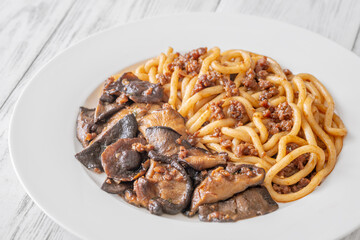 Unagi udon noodles served with beef and crispy garlic thyme shiitake