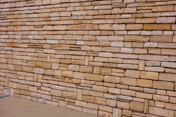 Wall made with yellow stone blocks