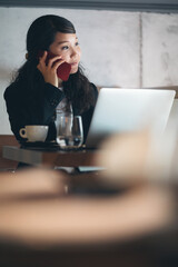 Young businesswoman working at restaurant