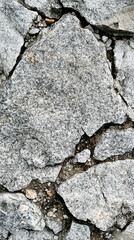 Obraz premium Grey granite plain stone texture with natural speckled pattern in a vertical format. Symbolizes strength, durability, and simplicity—ideal for backgrounds, surfaces, or architectural mockups.