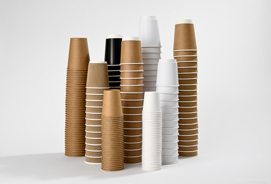 Upside down disposible cups for hot coffee or hot tea over white background    
