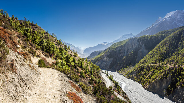 Panoramic view of the trekking route from Manang to Khangsar village and Mt. Annapurna II and III on the horizon.
