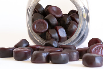 Melatonin and L-Theanine Sleep Gummies Spilled from a Jar