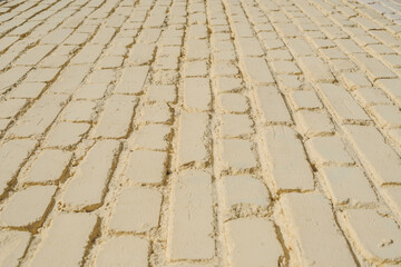 Fototapeta premium Closeup backgrounds texture of yellow beige painted retro brick wall.
