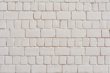 Closeup backgrounds texture of yellow beige painted retro brick wall.