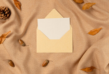 Empty white paper list on fabric background from above. Flat lay, top view.