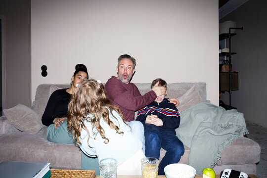 Happy family spending leisure time while playing with each other at home