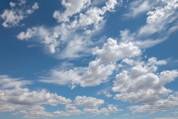 Obraz premium Thin White Clouds Drift Across a Pastel Blue Summer Sky in a Serene Afternoon Atmosphere Generative AI