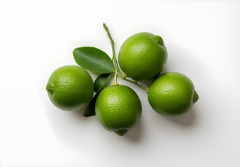 Green lemons with leaves on a white background
