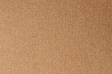 Fototapeta premium Plain brown cardboard sheet used for crafts or packaging materials in various projects