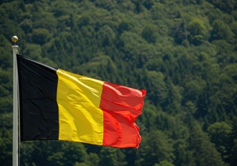Waving Belgian Flag Representing National Unity Amidst the Dense Rolling Forests of the Ardennes