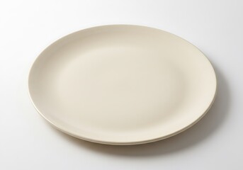 A simple ivory plate centered on a white background with soft shadows and clean minimalist style