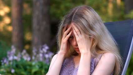 Fototapeta premium Caucasian Woman Finding Calm in Nature to Relieve Stress, Headache, and Emotional Burnout