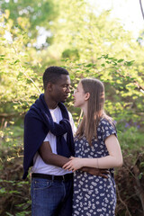 Fototapeta premium Romantic Mixed Race Couple in Summer field