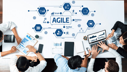 A dynamic team collaborates in a modern workspace, utilizing agile concepts to enhance productivity...